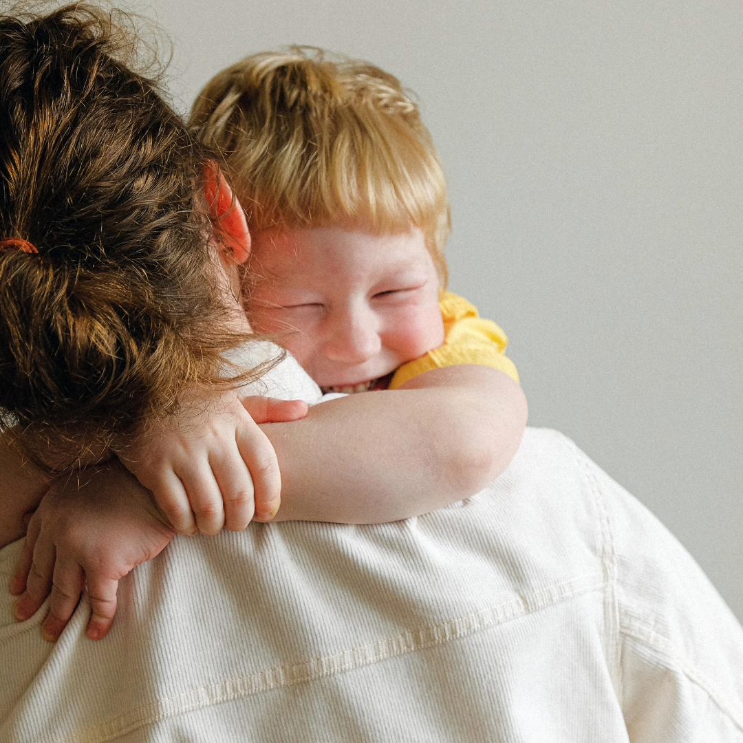 child and parent hugging